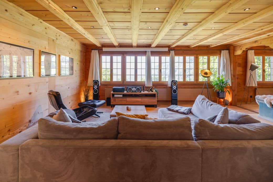 Large living room with mountain views, tiled stove, state-of-the-art home theater, gaming consoles