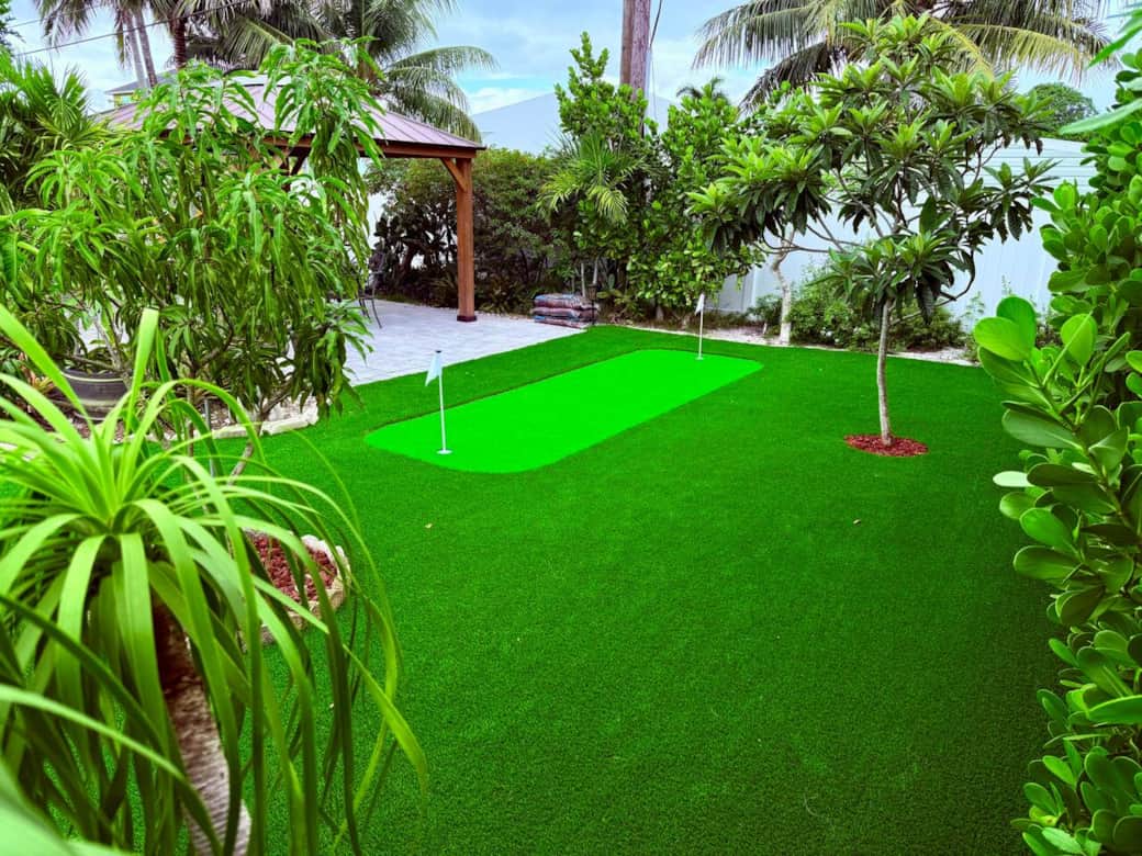 Our new putting green makes a wonderful addition to the already cozy and lush backyard experience!