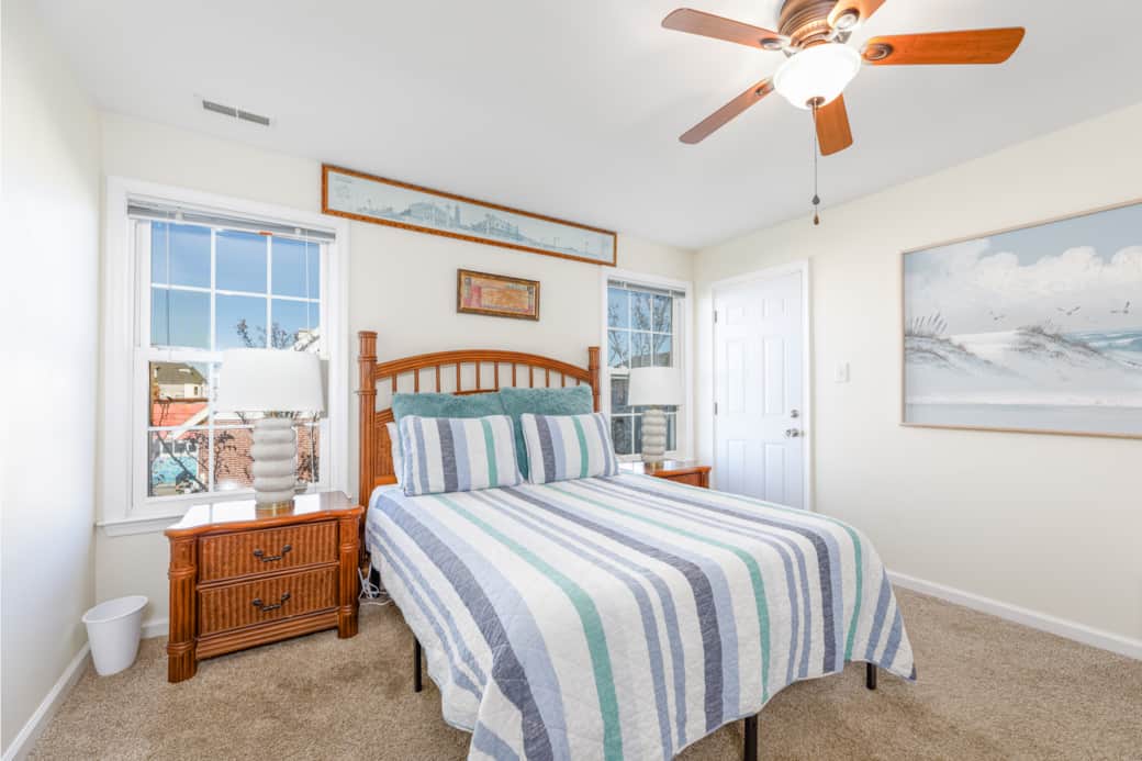 This is the master bedroom with an ensuite bathroom and a private patio