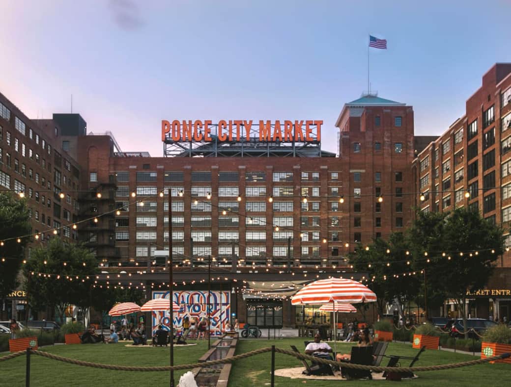 Ponce City Market lawn with outdoor dining and city views. Ponce City Market lawn with outdoor dining and city views.