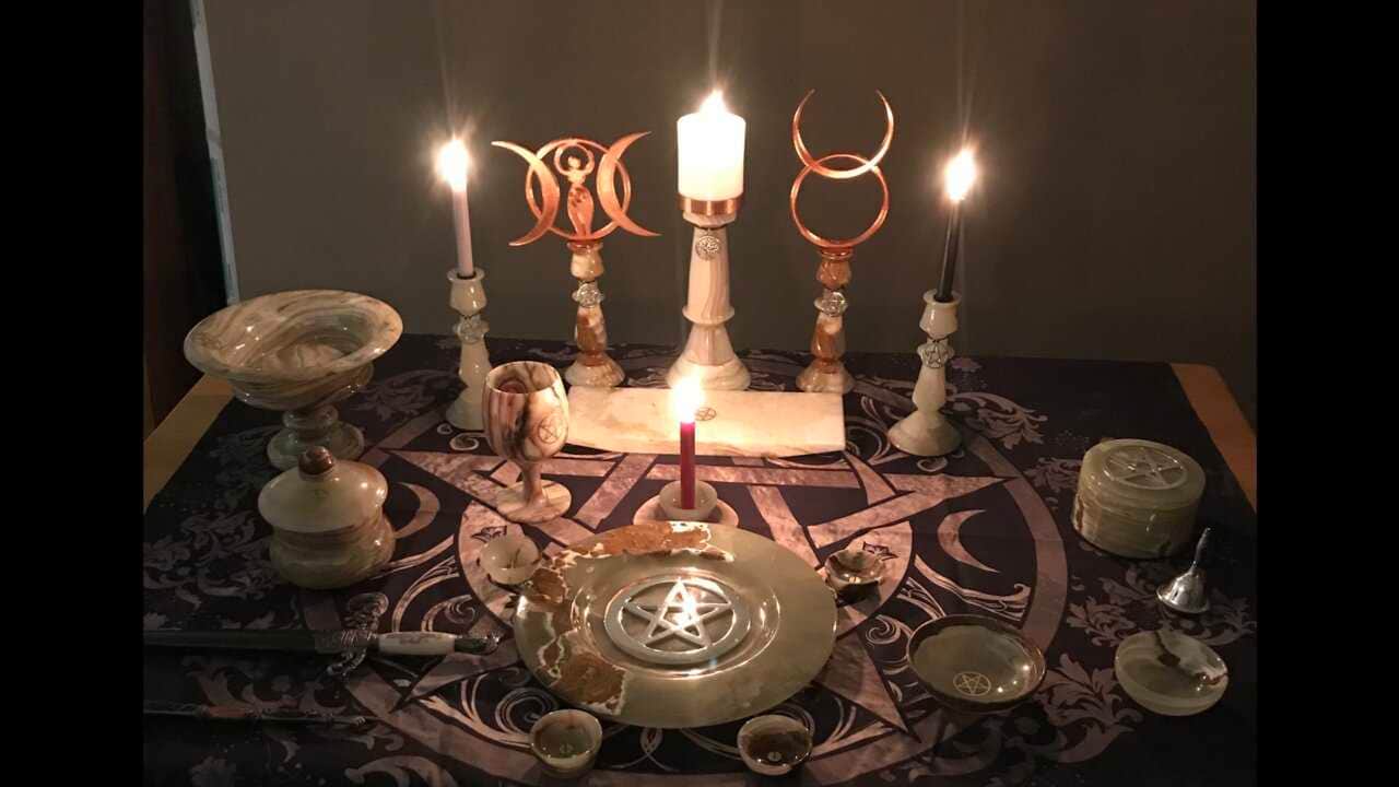 Gardnerian Wicca ritual altar with athame chalice and pentacle