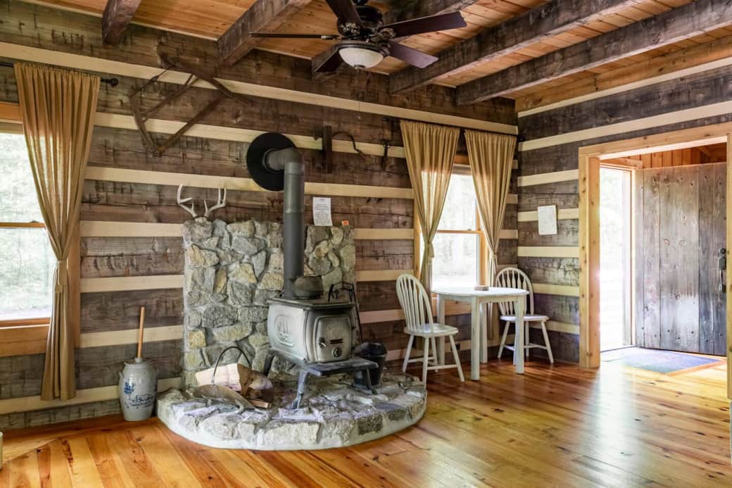 wood burning stove. open back door. dining table. wood burning stove. open back door. dining table.