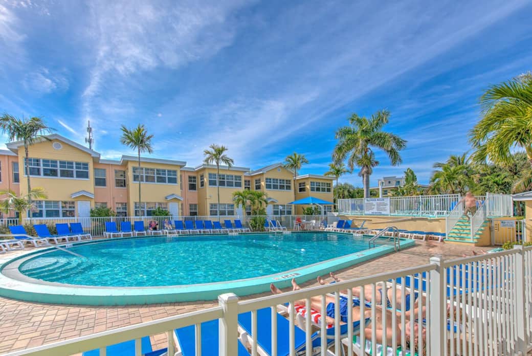 pool with plenty of chairs and sundeck