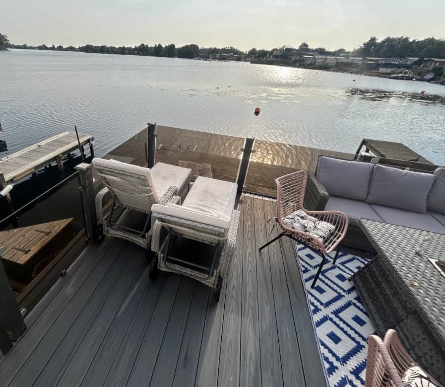 2nd Decking has table  - sofas - sunbeds and cooking area