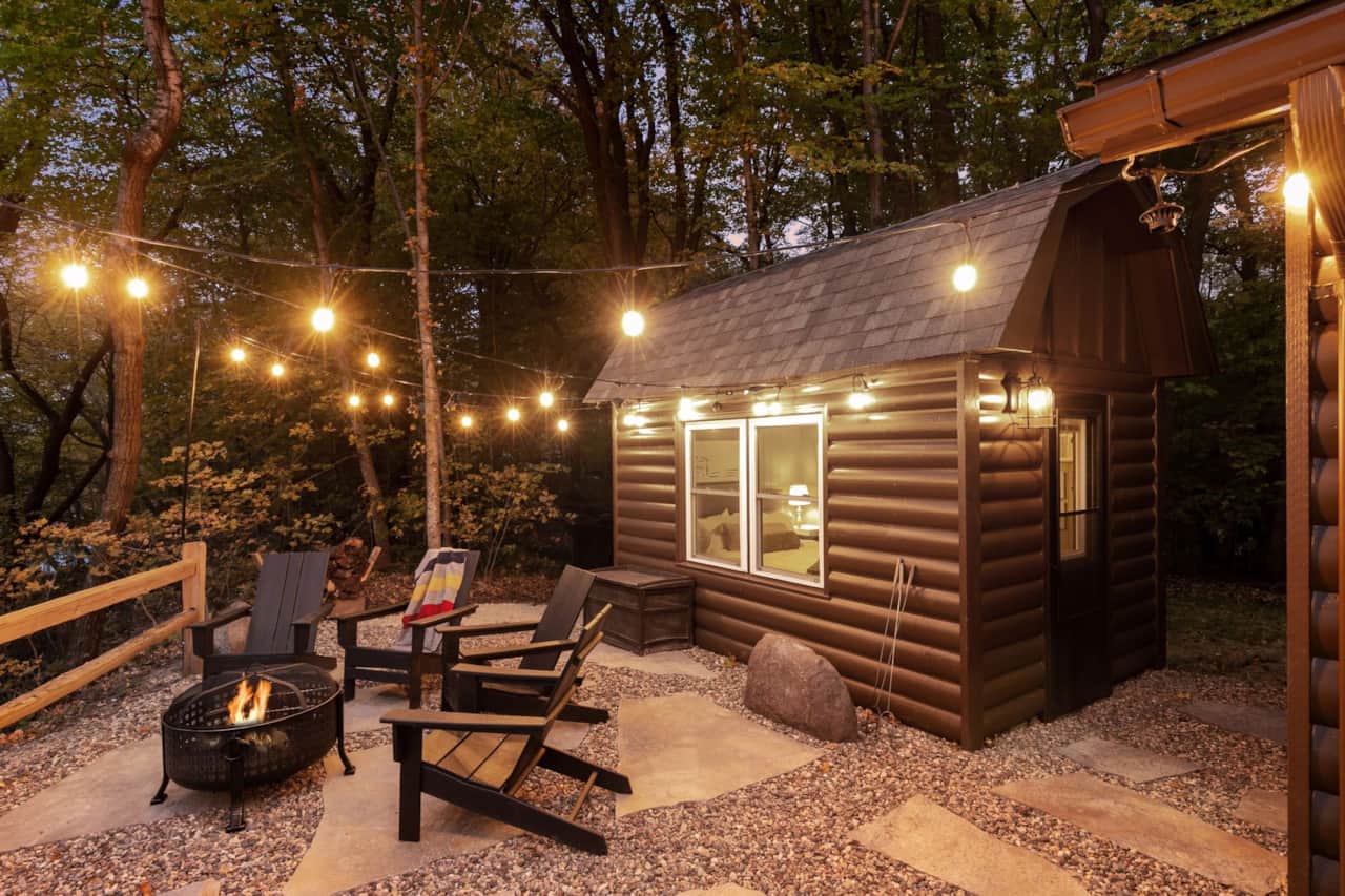 The bunkhouse and its own fire pit, a few steps from the cabin door.