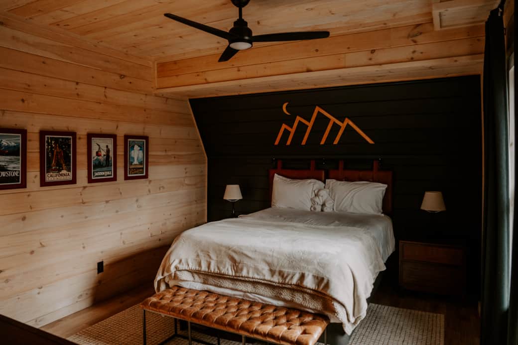 Main-level bedroom featuring a comfortable queen bed Main-level bedroom featuring a comfortable queen bed