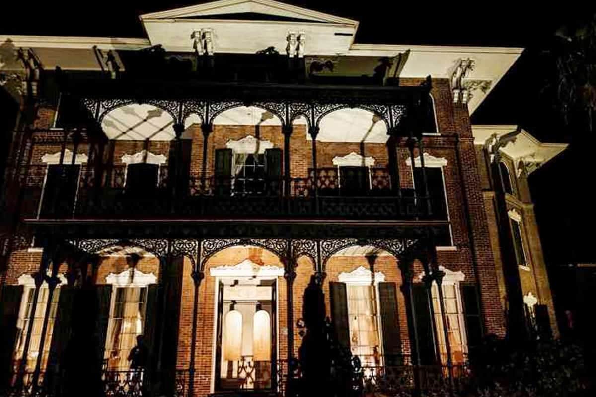 Ashton Villa lit up at night during a Galveston ghost tour