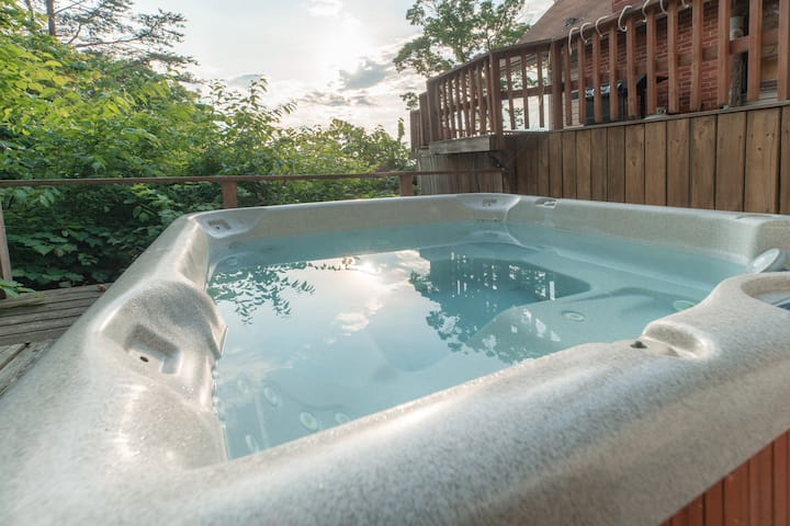 Soak in serenity: Our 4-person mountain-view hot tub is your private paradise, with no extra charge.