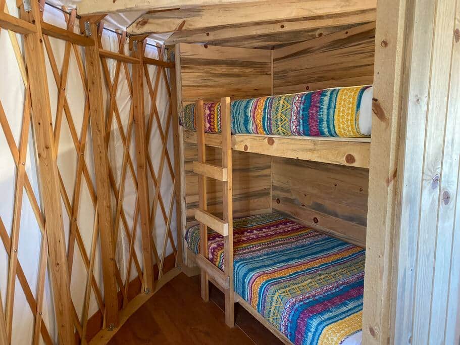 Bunk bed room with a wheelchair compatible lower bunk height and extra floor space.