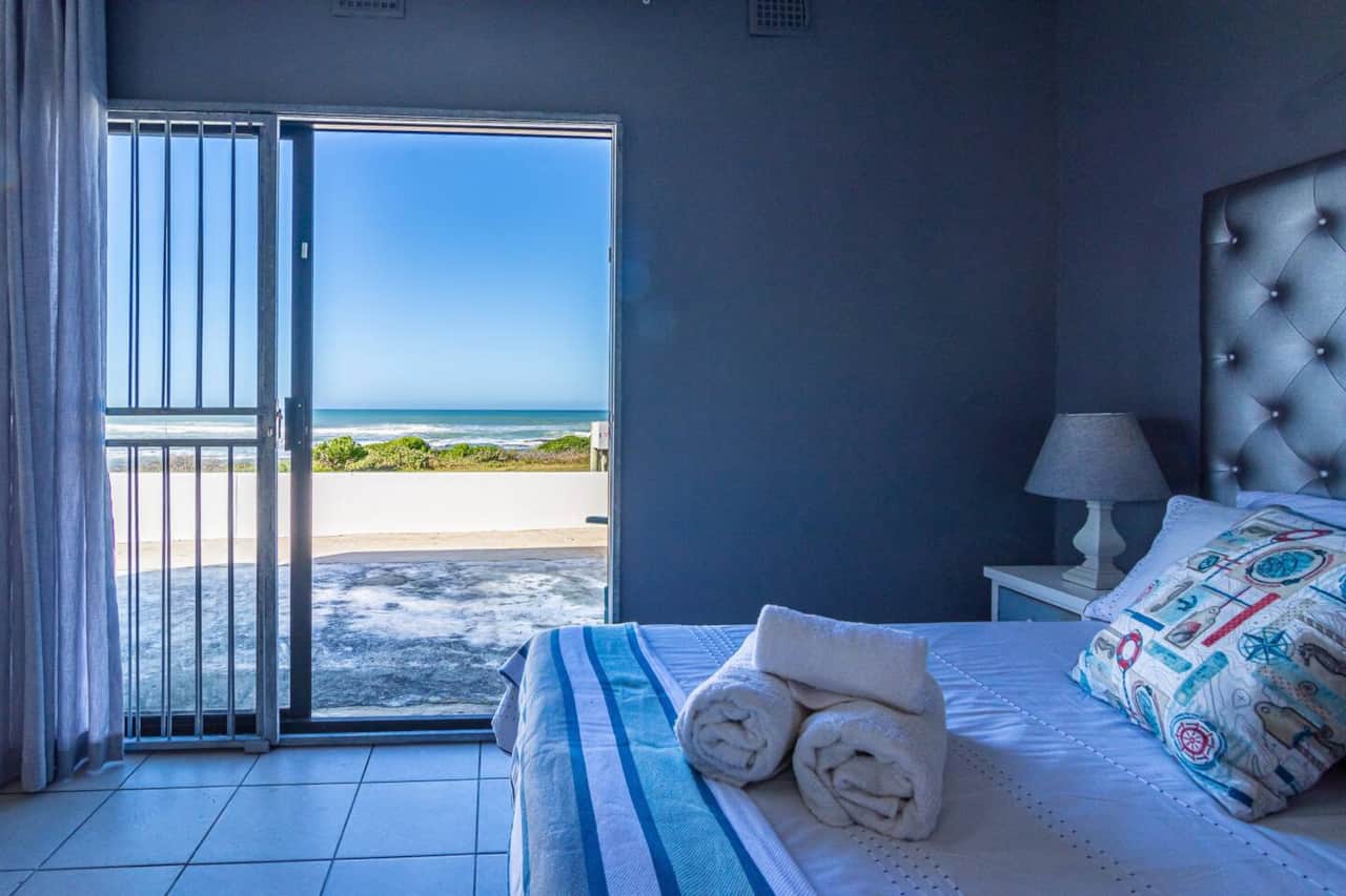 View from bed, opening onto patio
