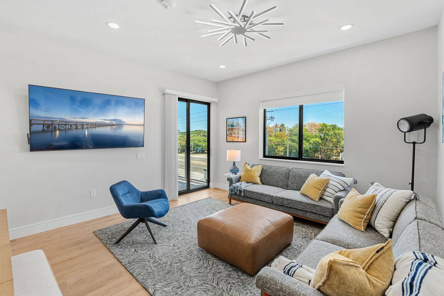 Enjoy casual lounging in this modern living area with plenty of natural light.