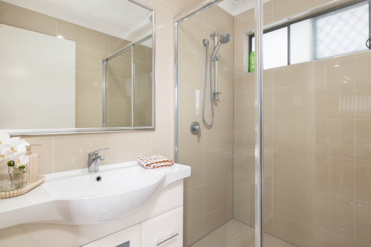 Bathroom: Stylish bathroom with walk-in shower, vanity, and clean finishes 