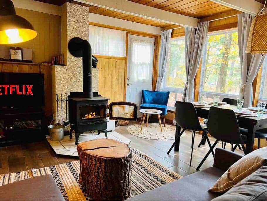View of part of the living room and dining room with beautiful windows and fire place