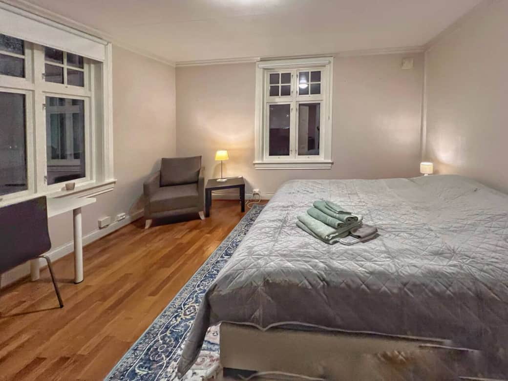 Bedroom 1: Spacious bedroom with workspace and armchair.  Bedroom 1: Spacious bedroom with workspace and armchair.