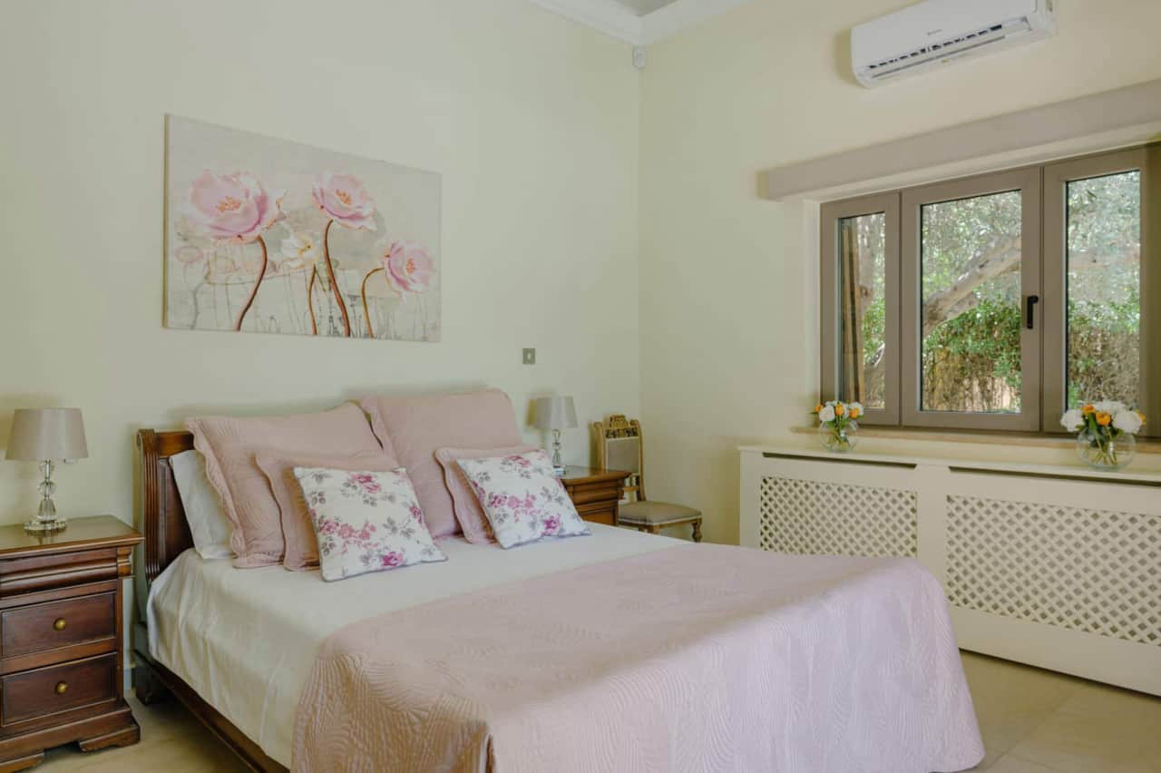 Ground floor en-suite fully fitted bedroom with double doors leading to the pool. Remote blinds.