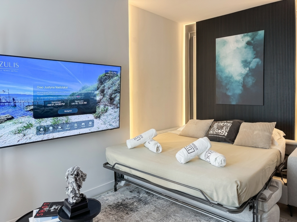 AZULIS DelleTerme Suites Apartment1 open living area with sofa bed for two guests and smart TV and r