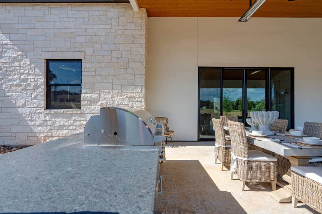The outdoor kitchen embraces Texas Hill Country charm in an elevated space. 