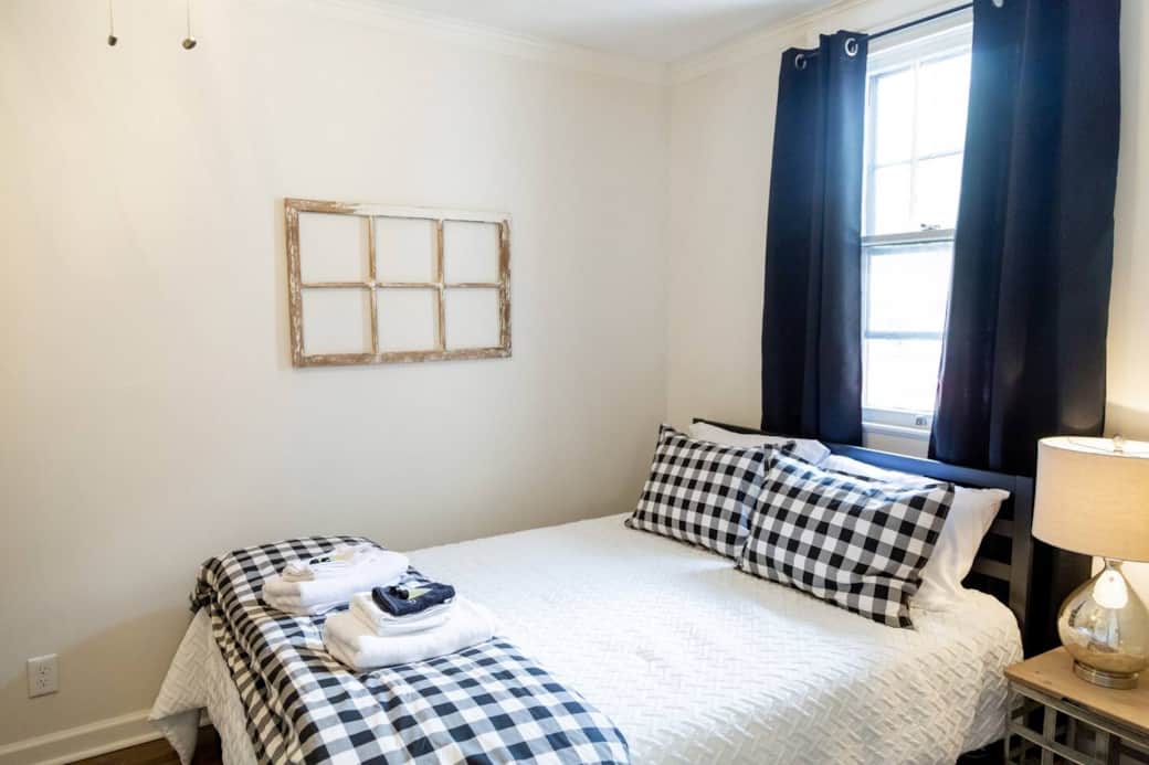 Just after you enter the front door, this bedroom is to the left.