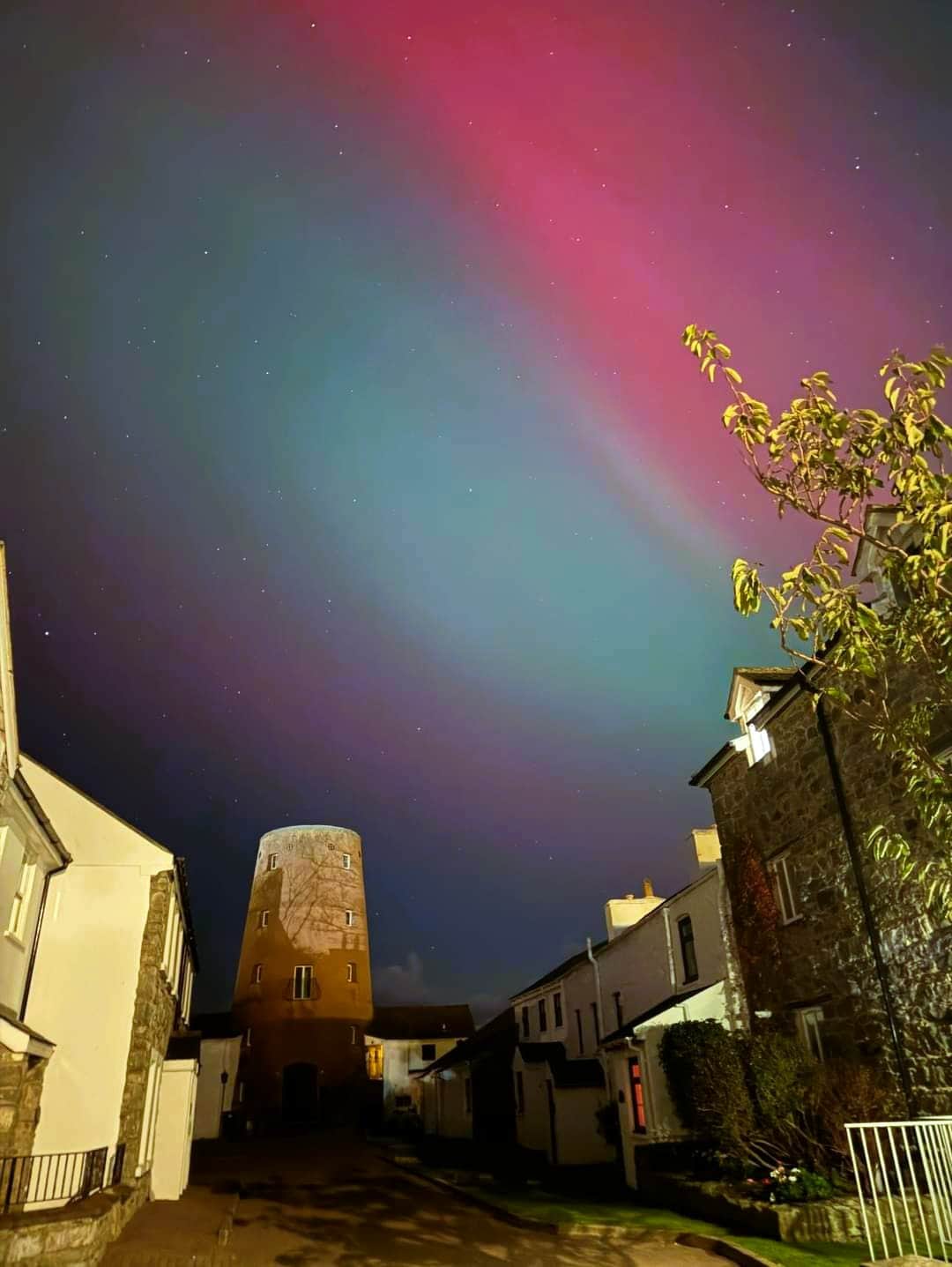 Northern lights seen at the Witches Mill in Castletown Isle of Man