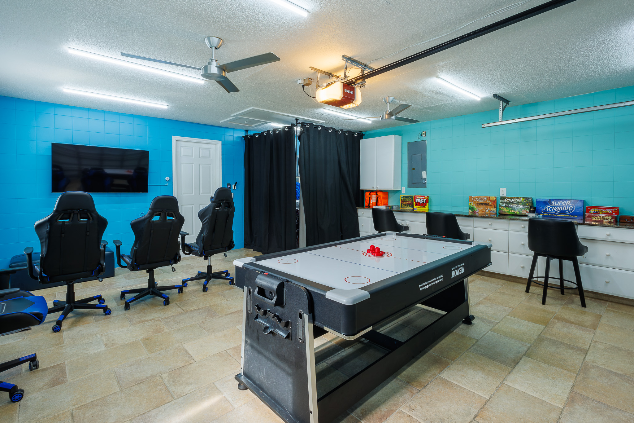 Fun and games await in the entertainment room, complete with an air hockey table for hours of enjoym
