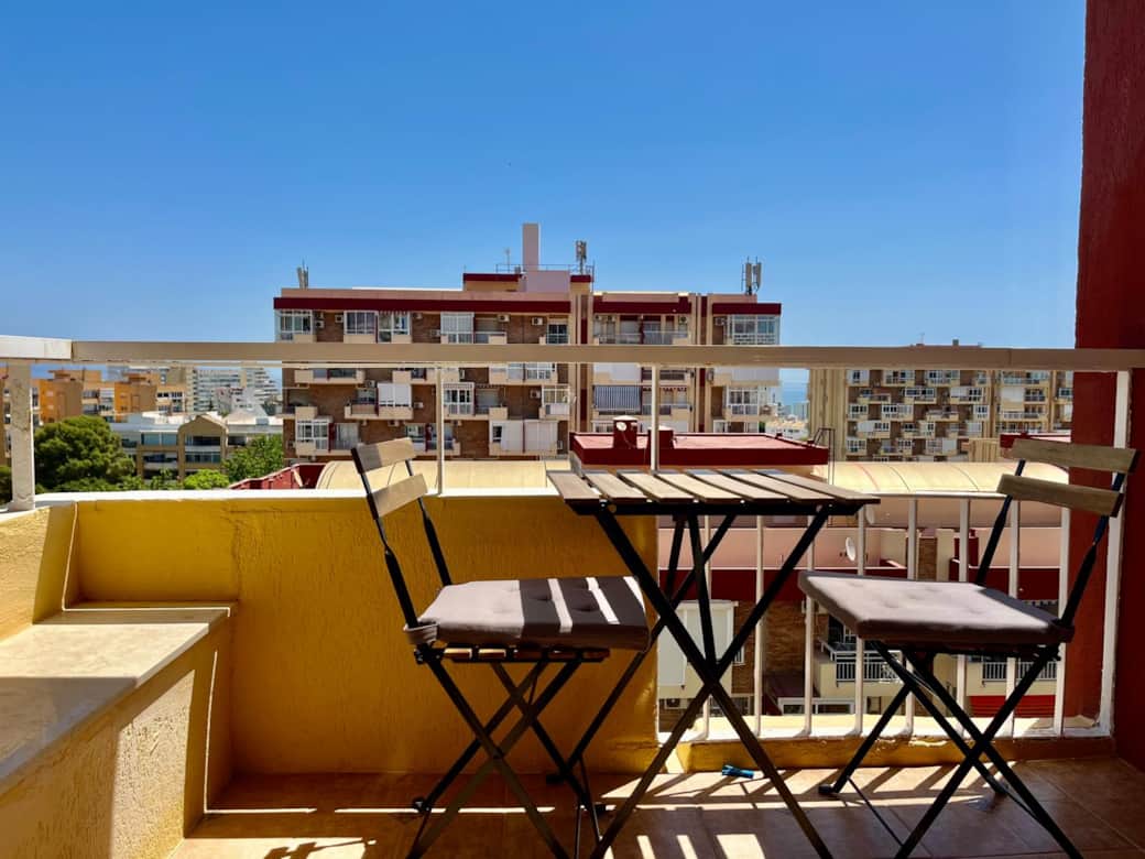 Balcony with table and chairs