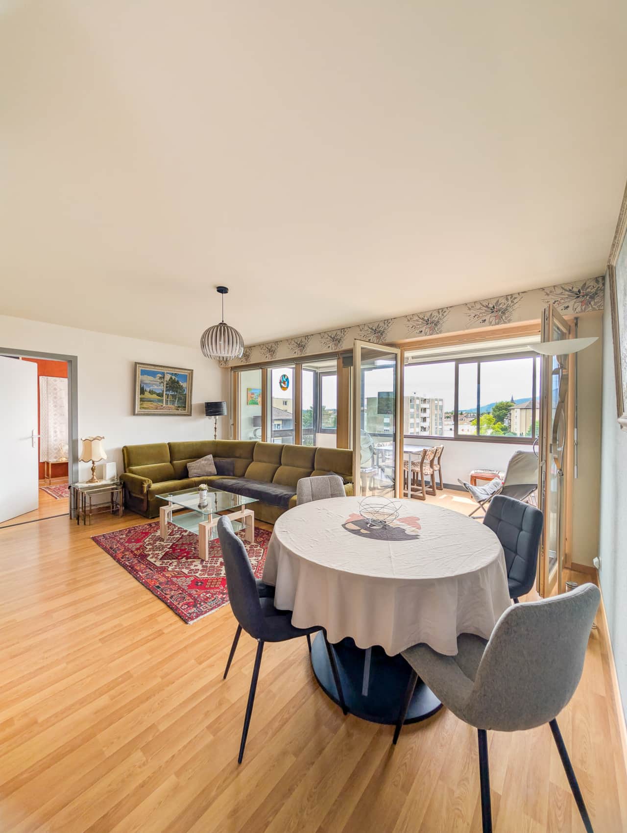 Bright living room with large bay windows