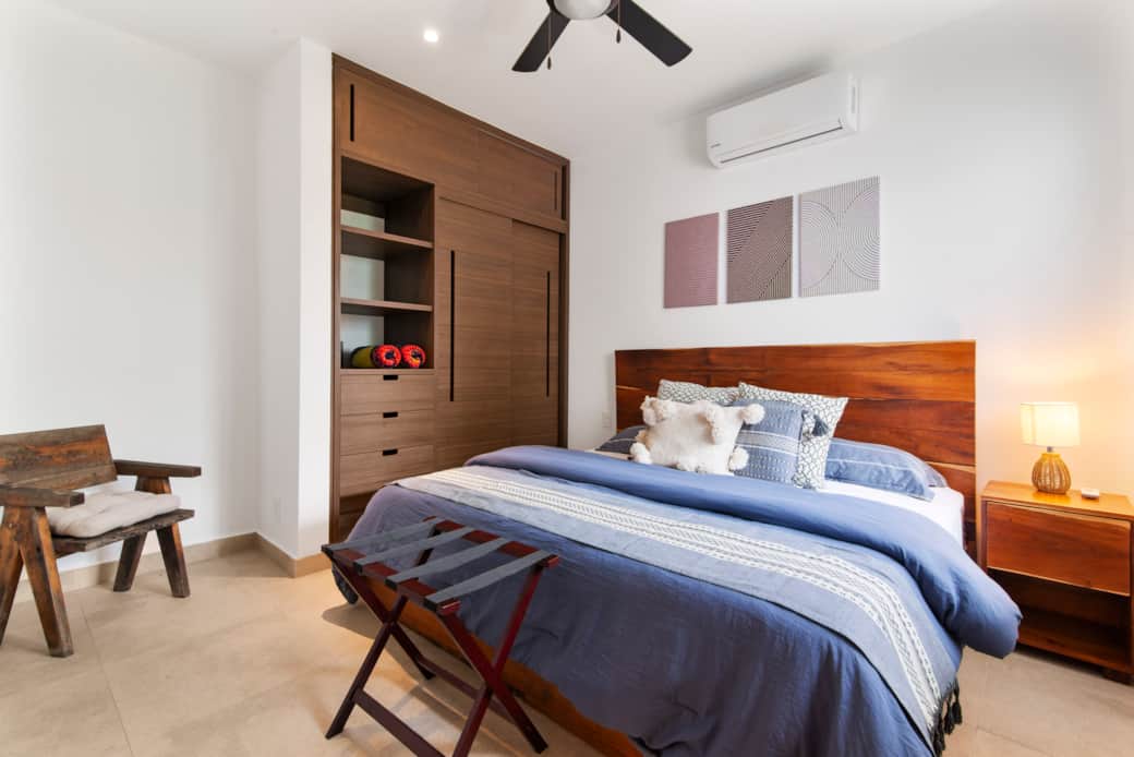 Comfort and productivity await in our bedroom with a wardrobe and towels.