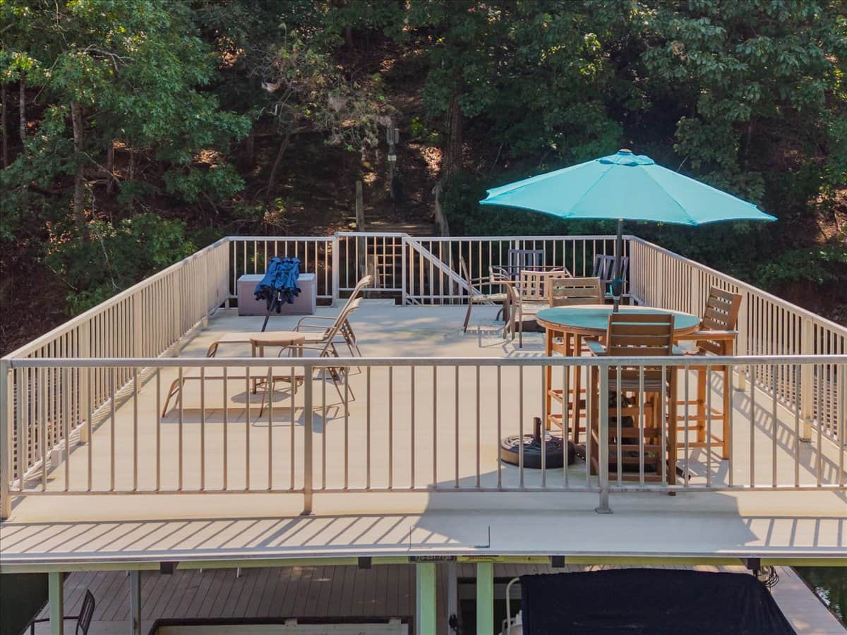 The two story dock offers plenty of seating including two lounge chairs and two dining tables. 