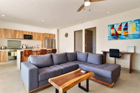 Unwind with loved ones in a cozy living room with TV & workspace.