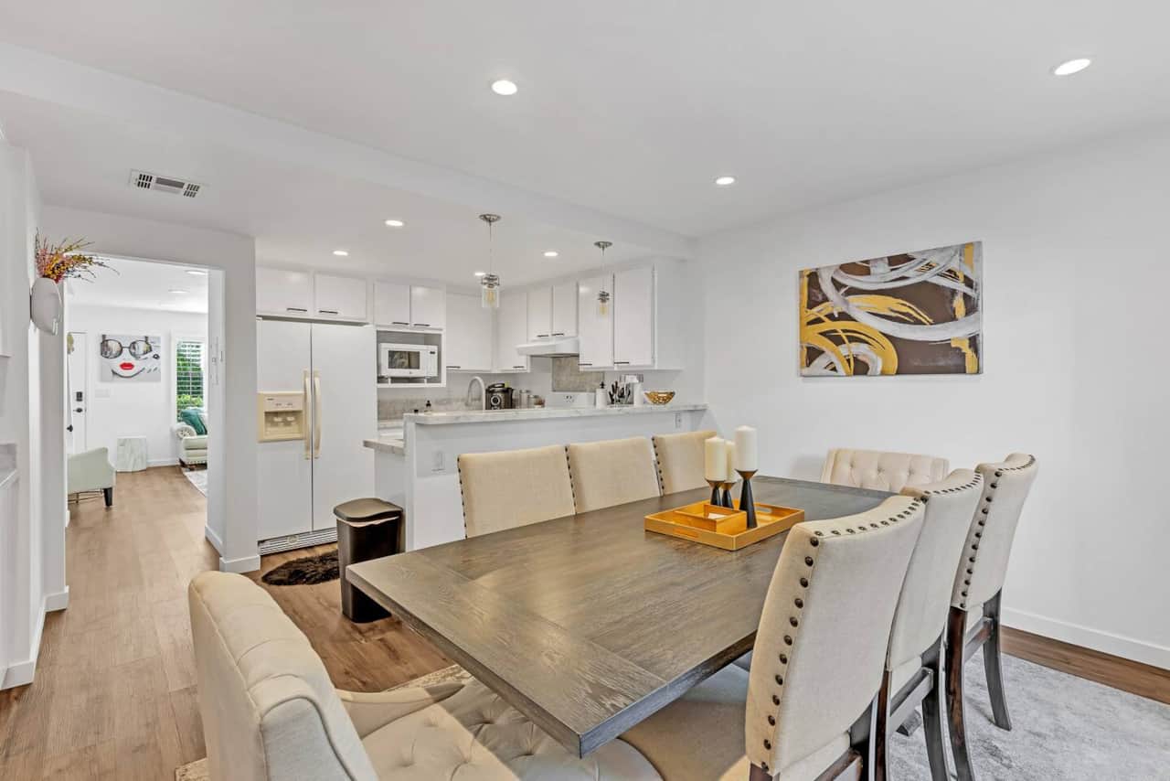 This inviting dining space, with a stylish table and comfortable seating, is ready for everything from cozy family dinners to festive gatherings.