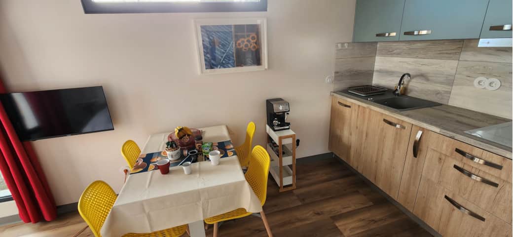 Sunny colourful kitchen at Floeca, your ocean-side Madeira stay for easy breakfasts and cosy dinners Sunny colourful kitchen at Floeca, your ocean-side Madeira stay for easy breakfasts and cosy dinners