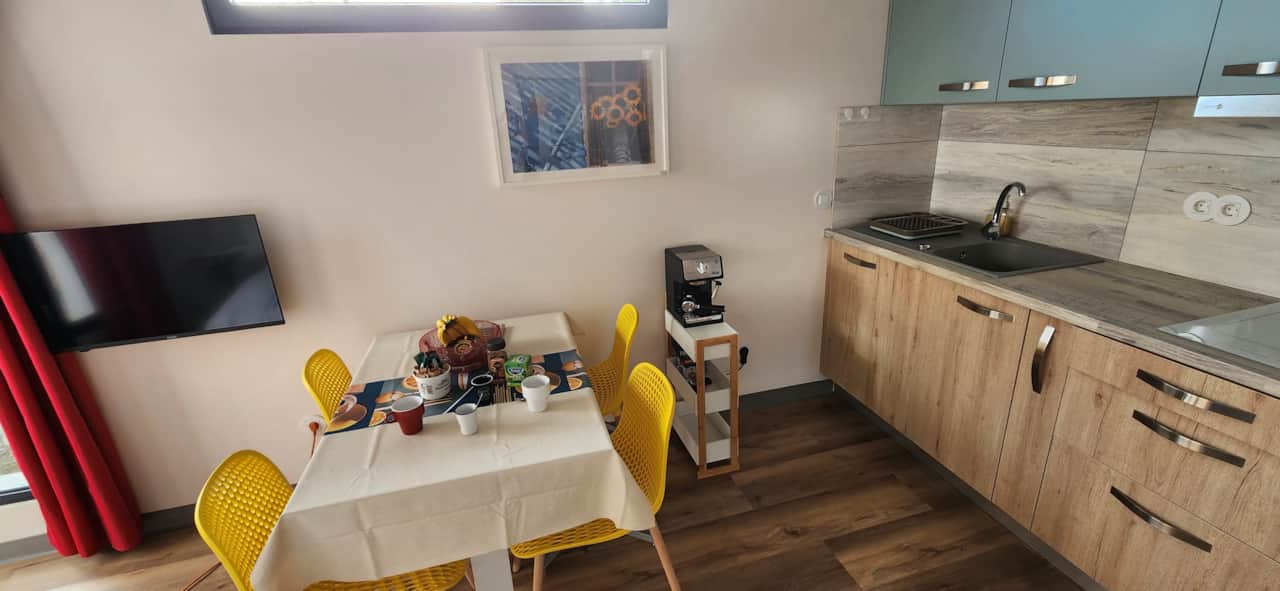 Sunny colourful kitchen at Floeca, your ocean-side Madeira stay for easy breakfasts and cosy dinners
