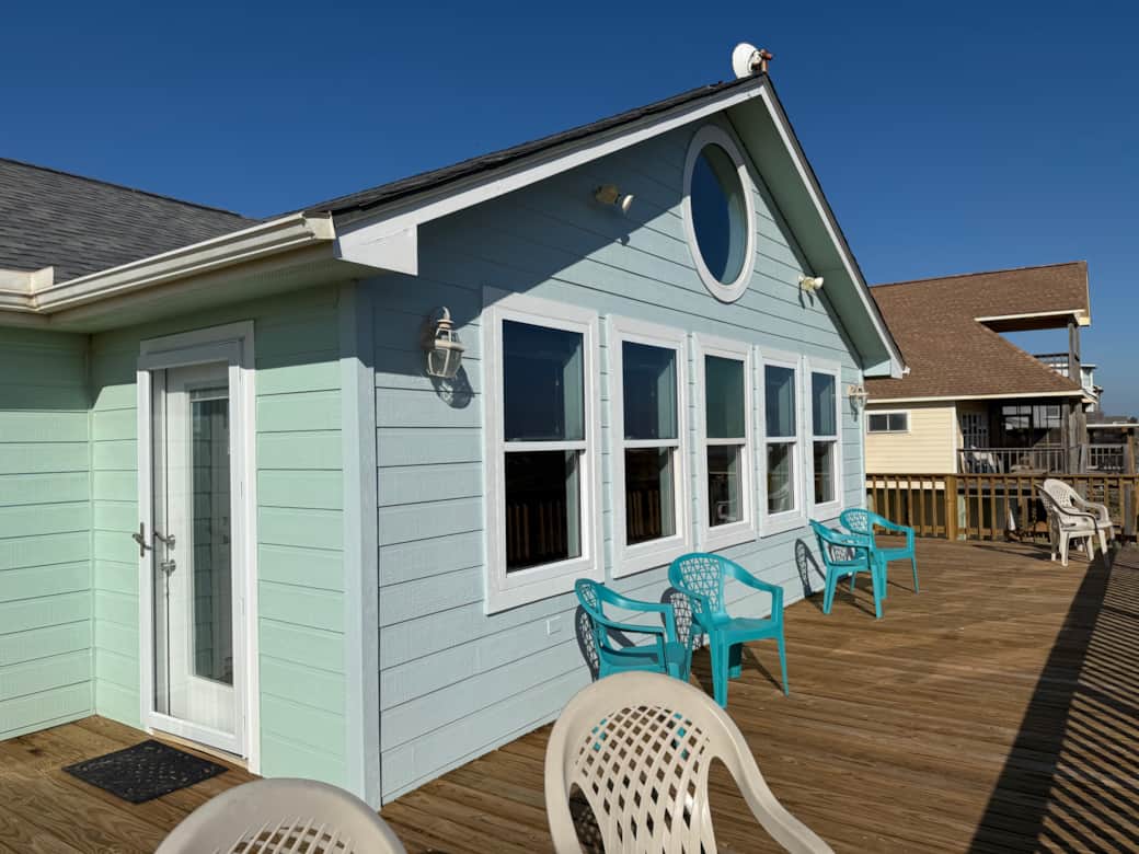 The deck wraps along the back of the home. There are doors from each bedroom and the living area. The deck wraps along the back of the home. There are doors from each bedroom and the living area.