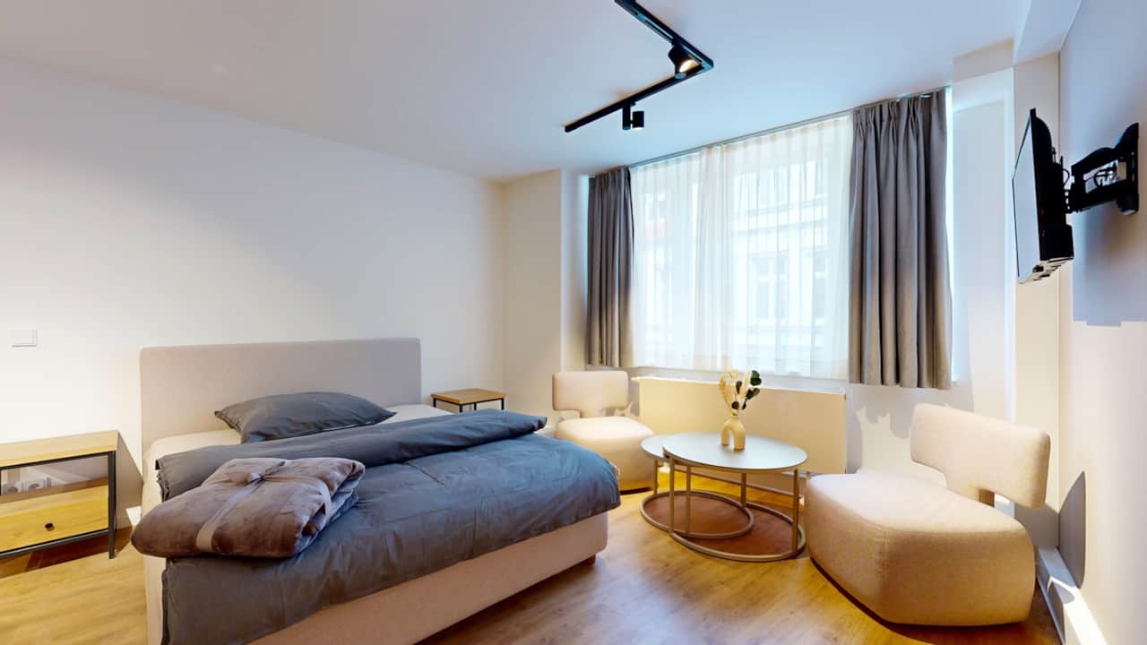 Gemütliches Schlafzimmer mit Doppelbett im N°8A Boardinghouse