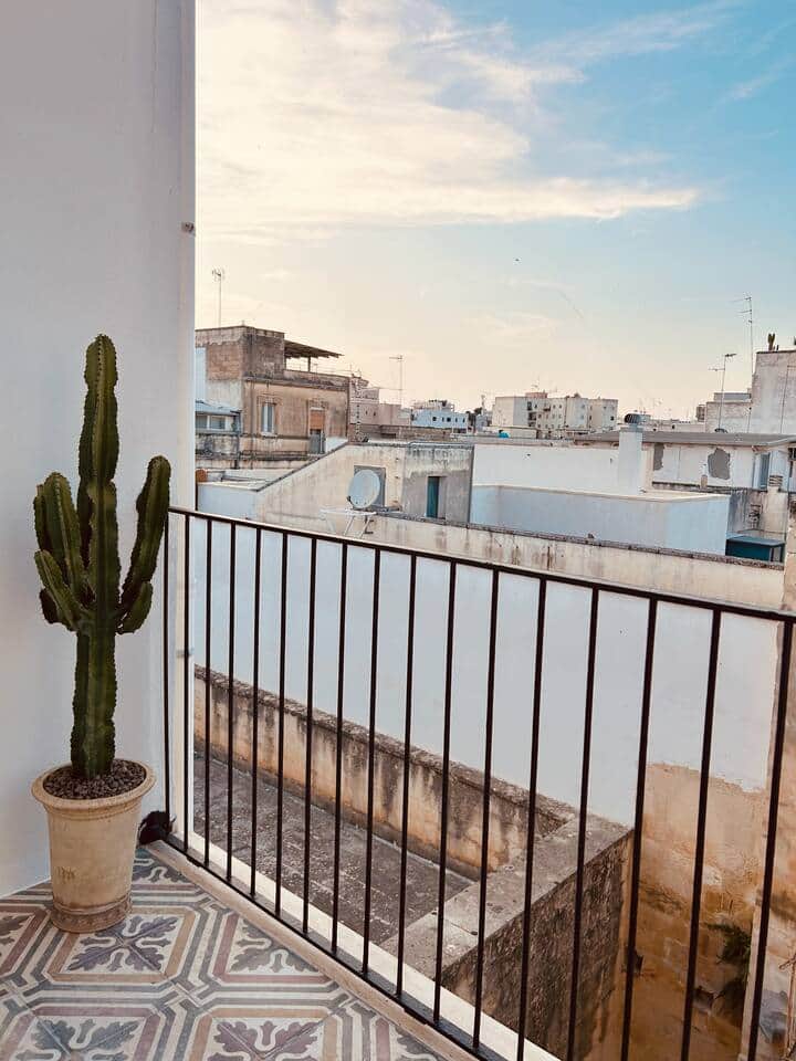 Antique Salento cementine tiles on the bedroom balcony, reflecting the colours of the neighbourhood