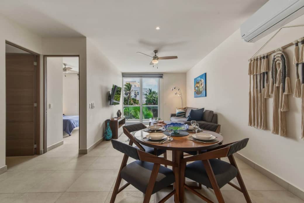 Enjoy your meals in this inviting dining area for 4, with A/C to keep you cool and a relaxing view to set the vibe. Includes dinnerware for a comfortable, at-home dining experience. Enjoy your meals in this inviting dining area for 4, with A/C to keep you cool and a relaxing view to set the vibe. Includes dinnerware for a comfortable, at-home dining experience.