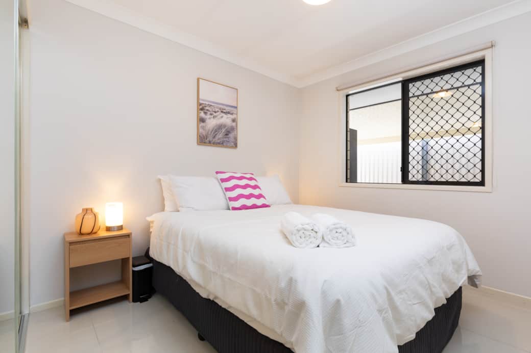 Bedroom 1: Peaceful bedroom with cozy design and ample storage