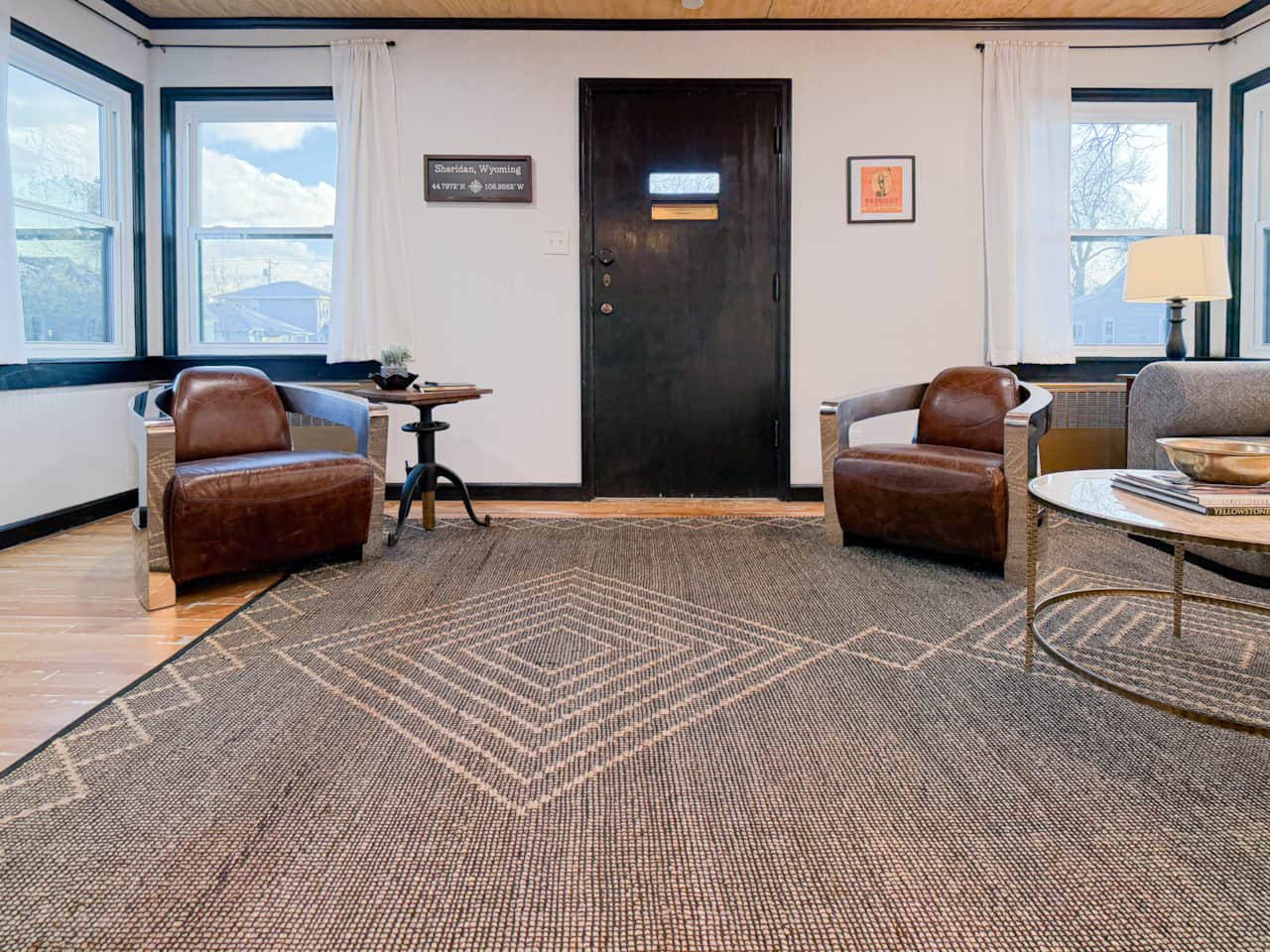 Restoration Hardware chairs  adorn either side of the front door.