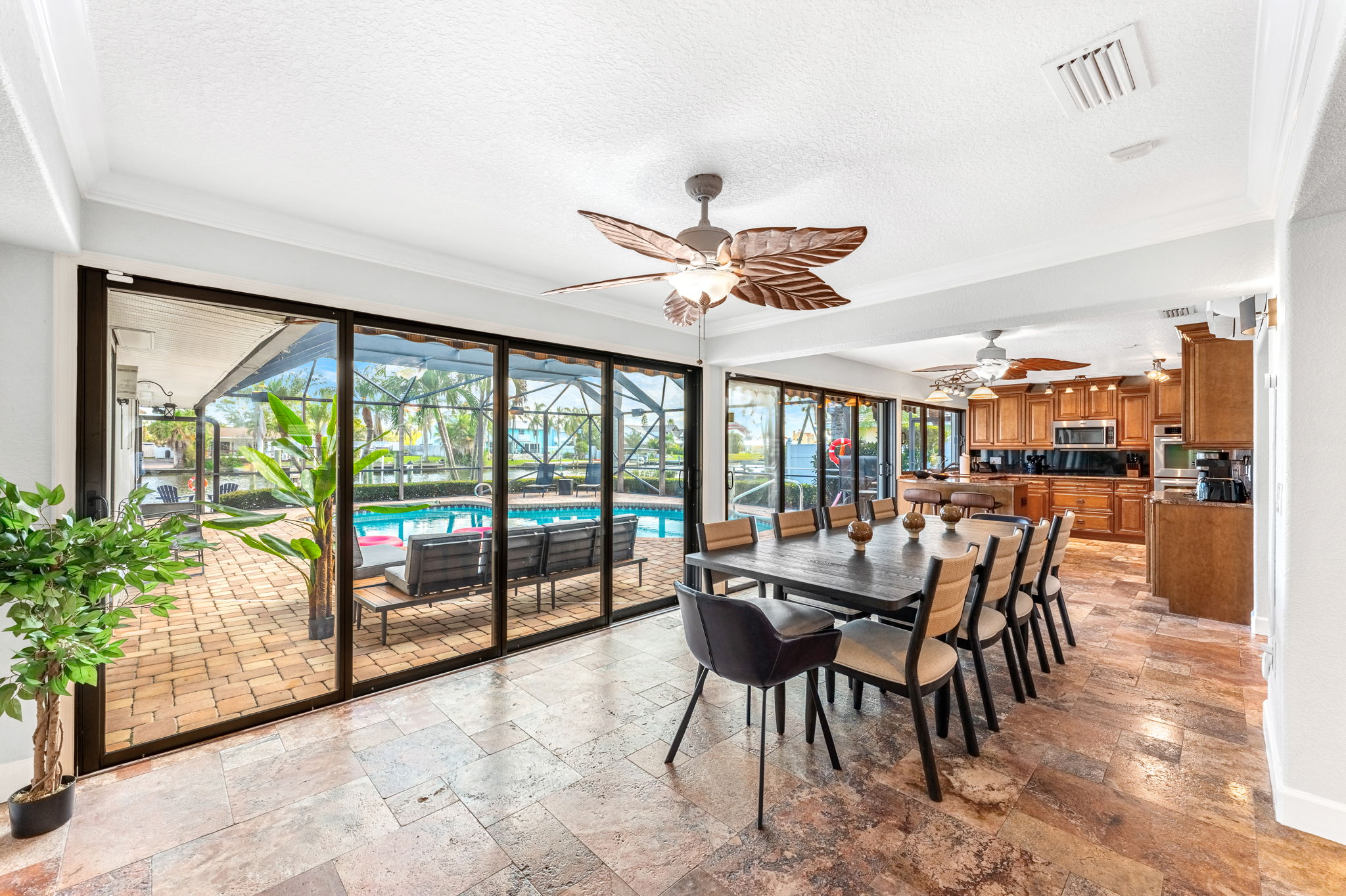 The dining area overlooks the pool, making every meal feel like an escape into paradise.