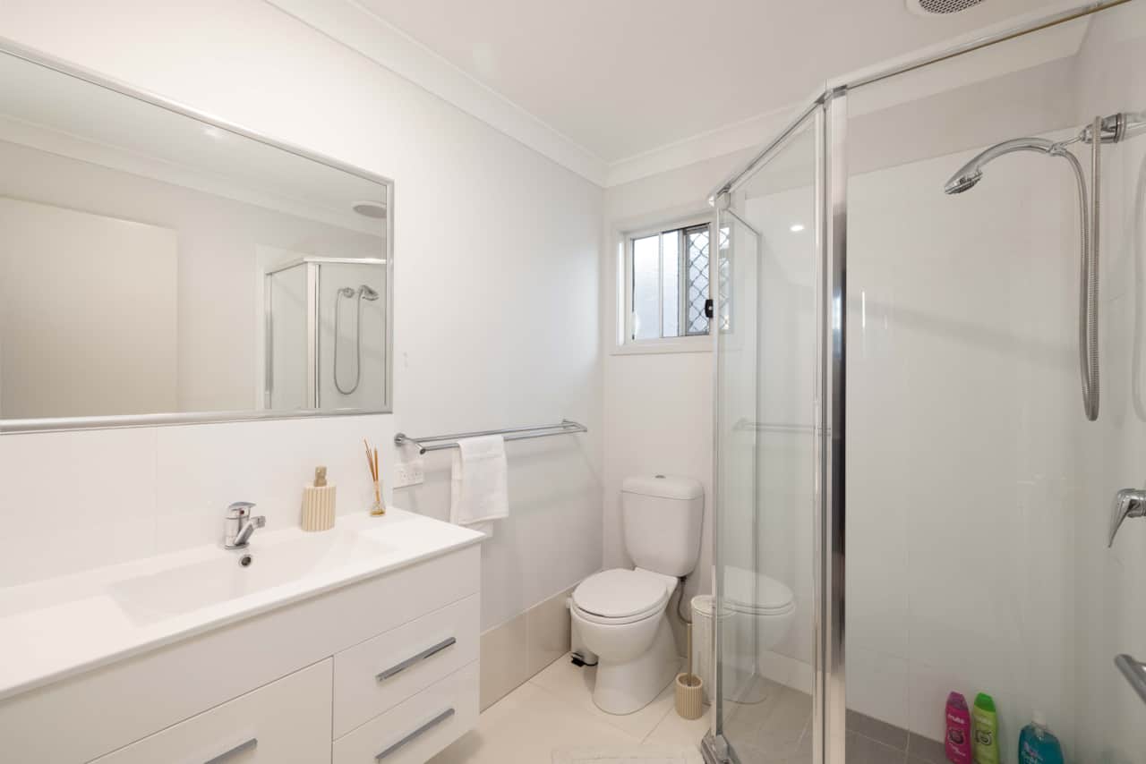 Bathroom: Stylish bathroom with walk-in shower, vanity, and clean finishes 
