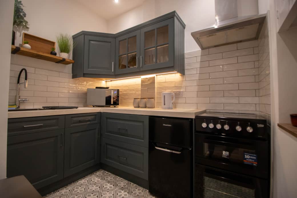 Full kitchen with oven, hob and microwave