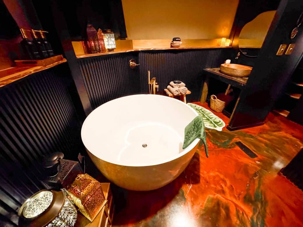 Indulge in the spa-like bathroom with a luxurious 53” soaking tub and rain shower, creating the ultimate romantic escape for relaxation and rejuvenation. A perfect romantic retreat or honeymoon just outside of Dallas in the wooded countryside. Indulge in the spa-like bathroom with a luxurious 53” soaking tub and rain shower, creating the ultimate romantic escape for relaxation and rejuvenation. A perfect romantic retreat or honeymoon just outside of Dallas in the wooded countryside.