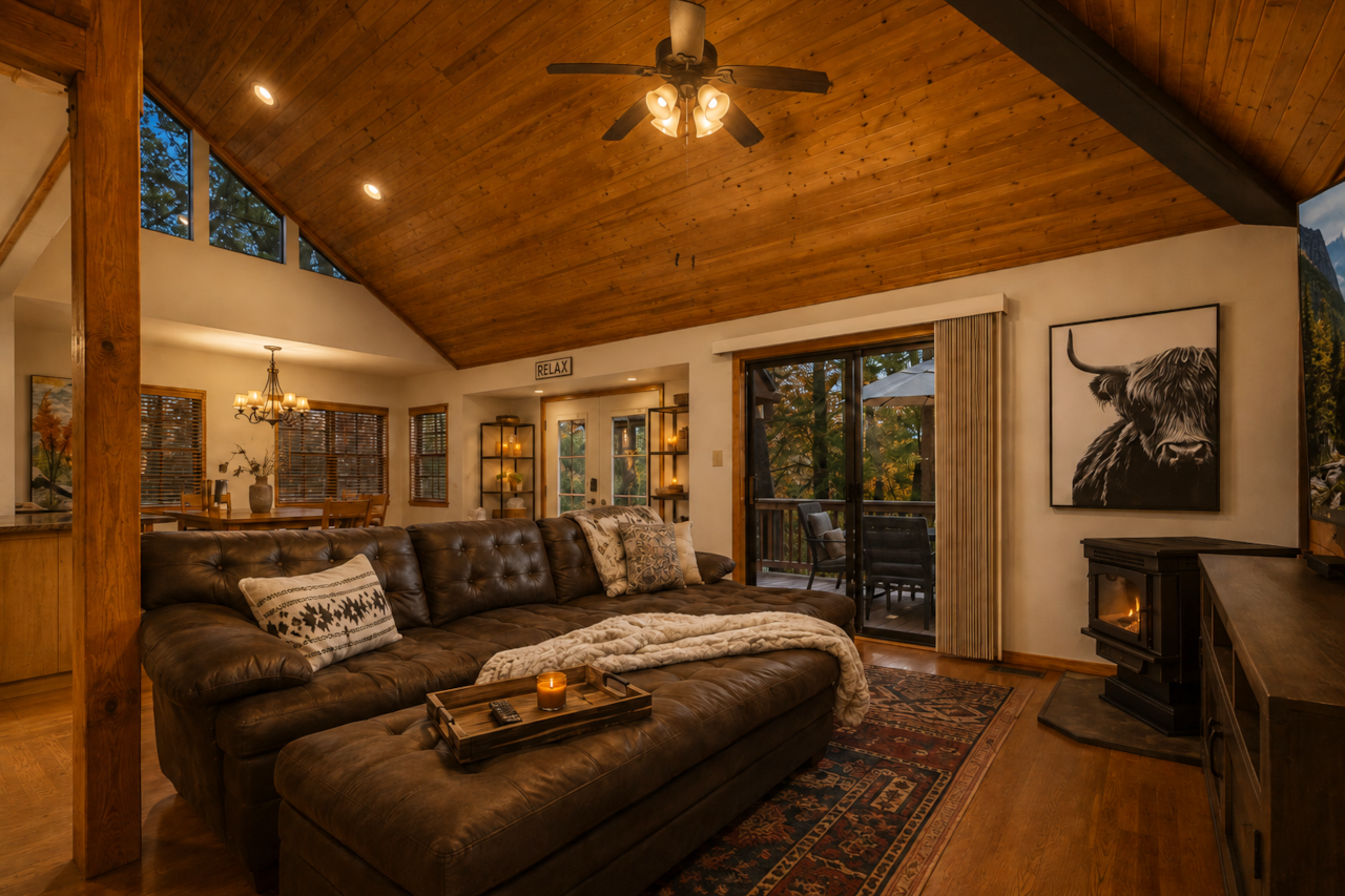 Living room with sofa and deck access in Munds Park cabin