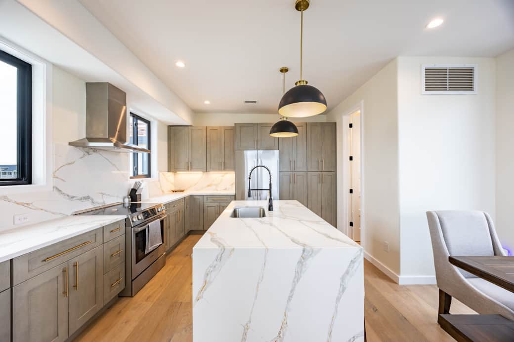 Modern kitchen with island at Driftwood Carolina luxury beach house