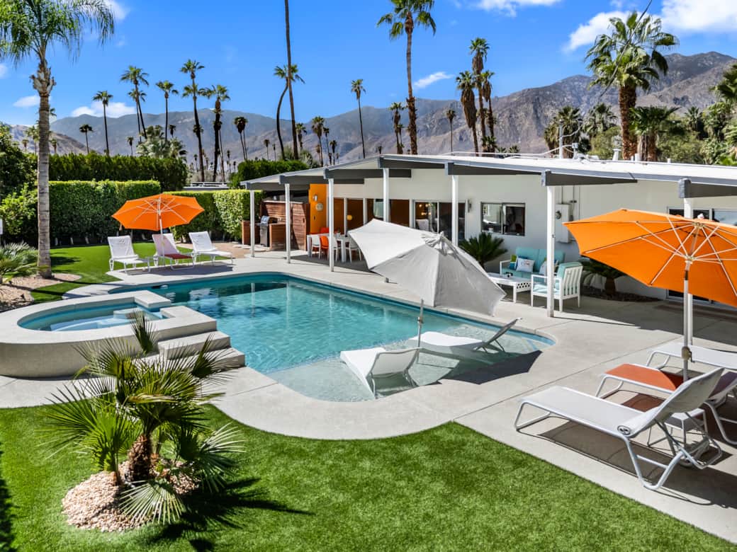 Mid-century pool, palm views, and desert sun — Palm Springs perfected.