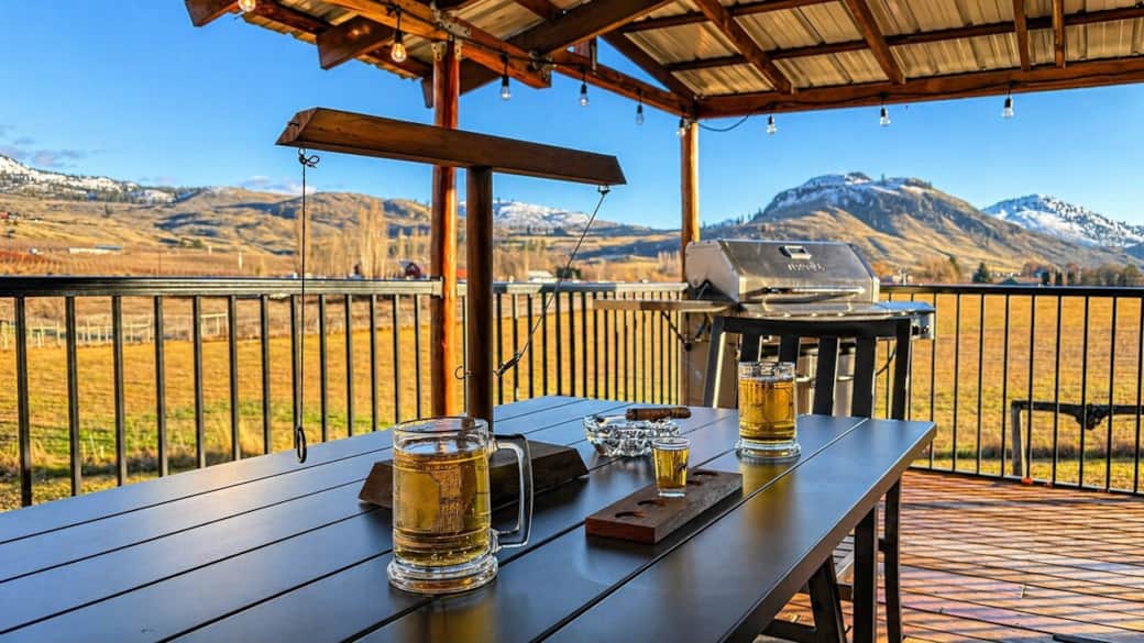 Dine outdoors by the BBQ with valley and mountain views.