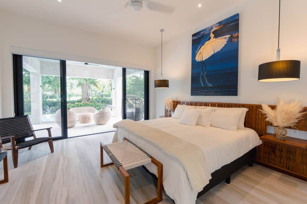 Main Bedroom with large bathroom, king size bed, and direct access to all outdoor patio, garden, and pool areas. Main Bedroom with large bathroom, king size bed, and direct access to all outdoor patio, garden, and pool areas.