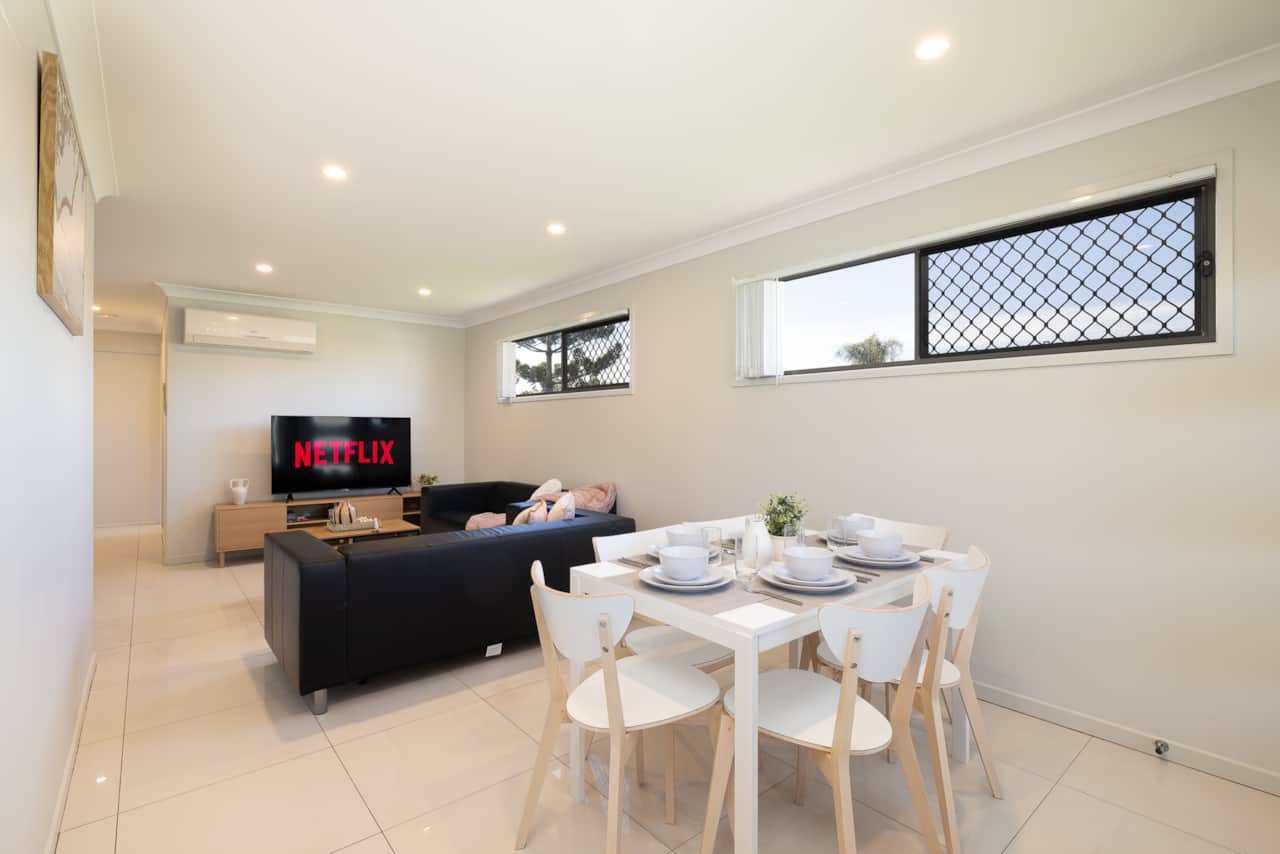 Dining Area: Integrated dining area within open living layout 