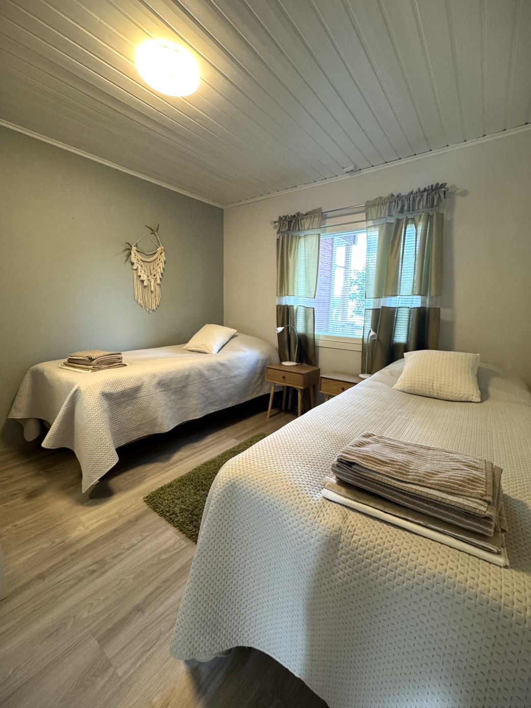 This spacious bedroom has two single beds and a large wardrobe. This spacious bedroom has two single beds and a large wardrobe.