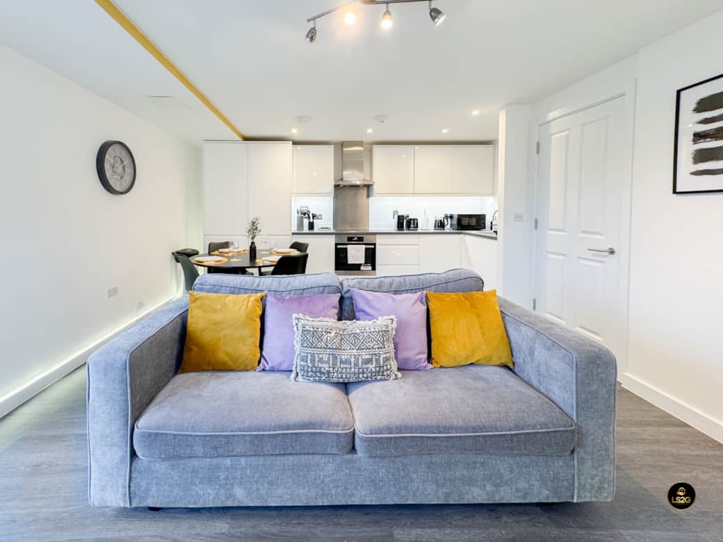 Living area with Balcony, Sofa bed and 55" Smart TV Living area with Balcony, Sofa bed and 55" Smart TV